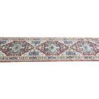 Maroon and green Persian runner rug detail