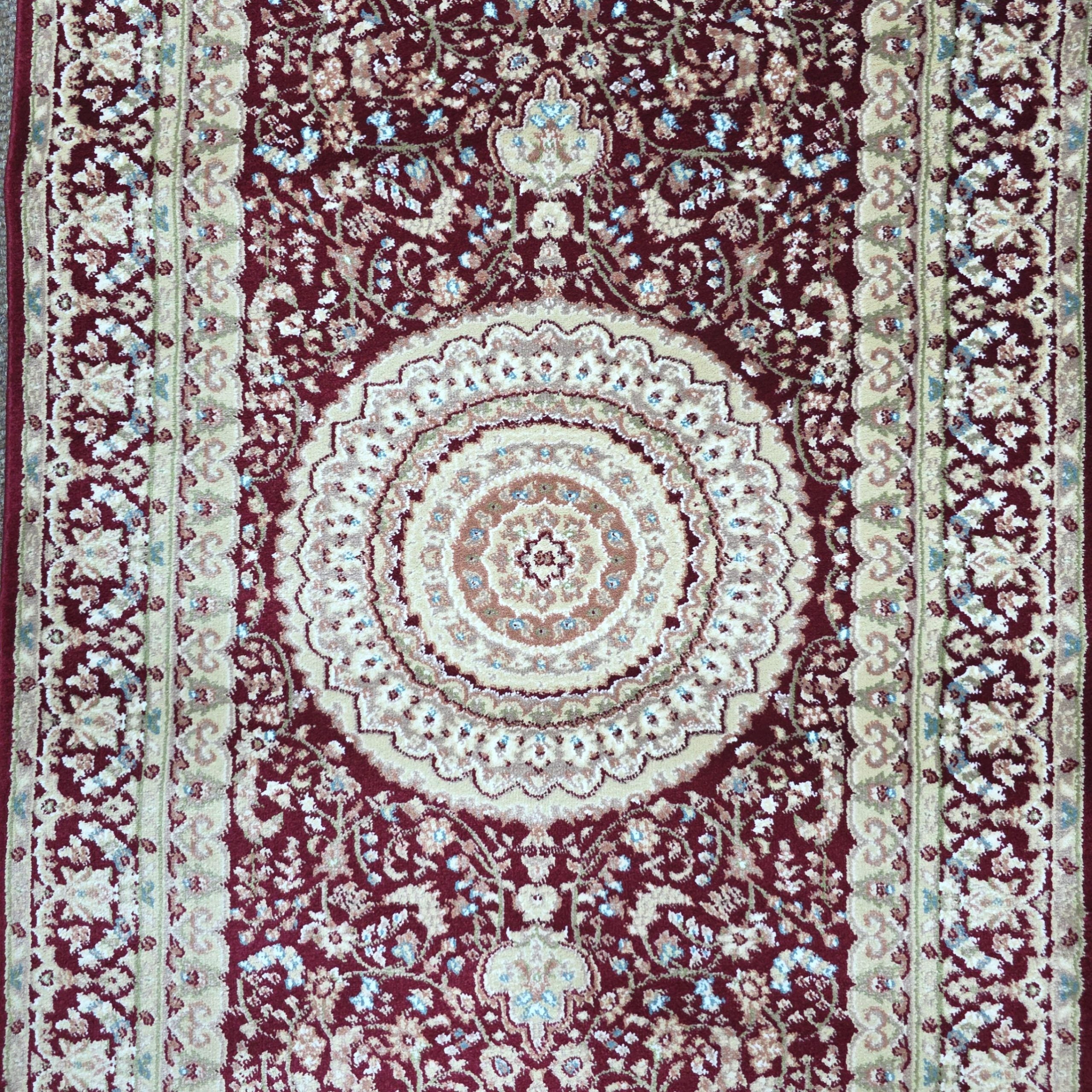 Deep red Persian design runner rug detail