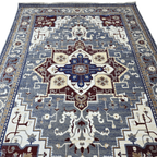 Grey and maroon Heriz design rug detail