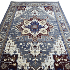 Grey and maroon Heriz design rug detail