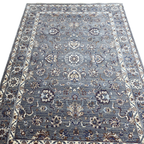 Grey and maroon traditional oriental rug detail