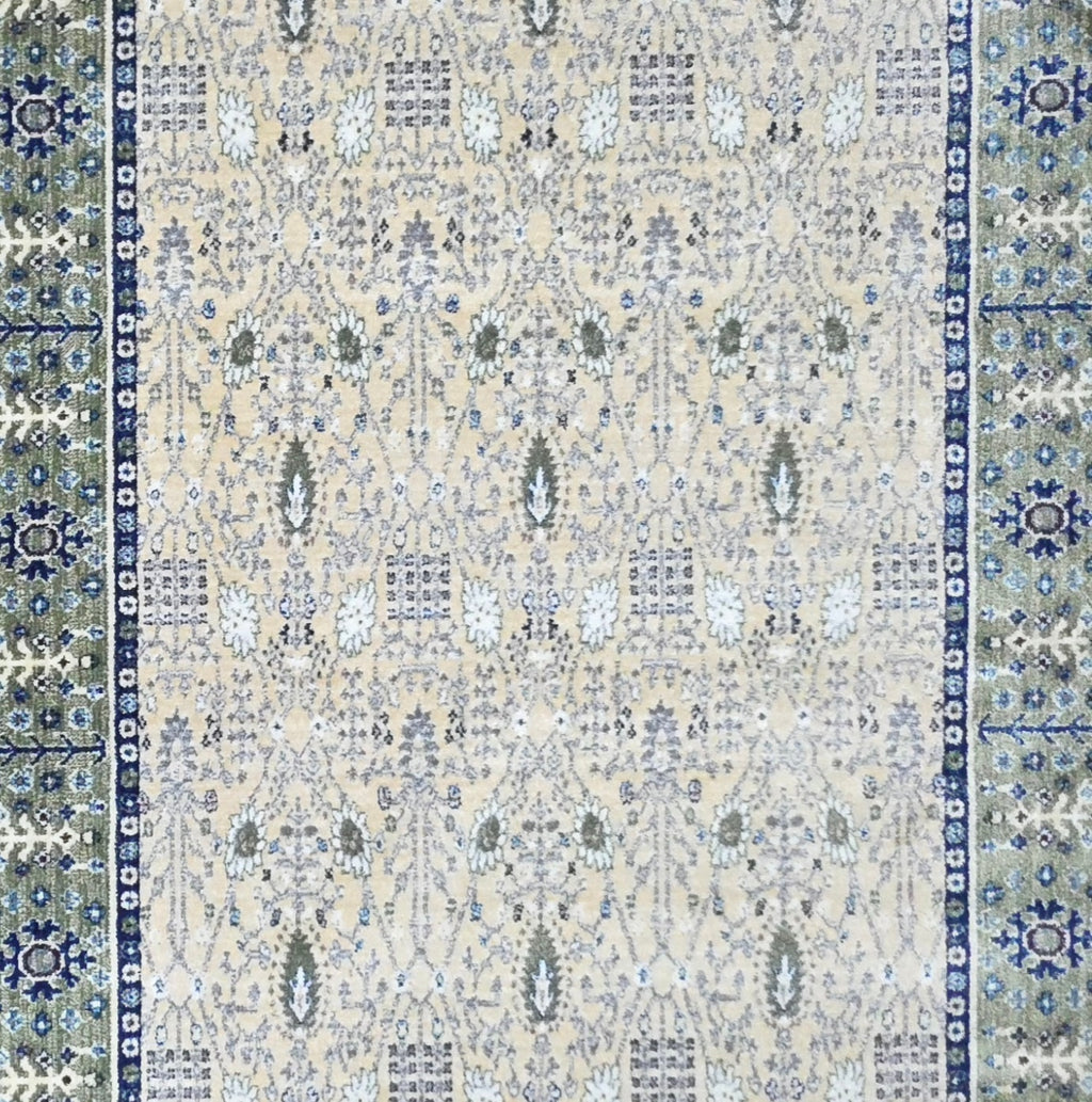 Cream and green traditional oriental rug detail