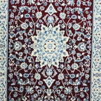 Red Persian design runner rug detail