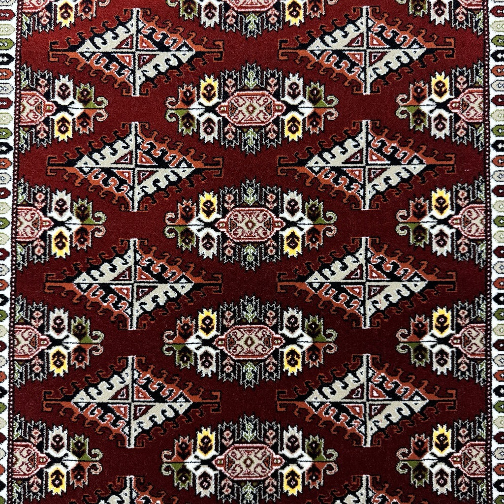 Burgundy Bokhara rug detail