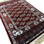 Burgundy Bokhara rug detail