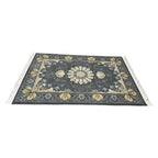 Charcoal and gold Persian rug detail