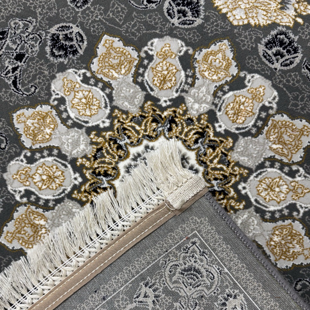 Charcoal and gold Persian rug detail