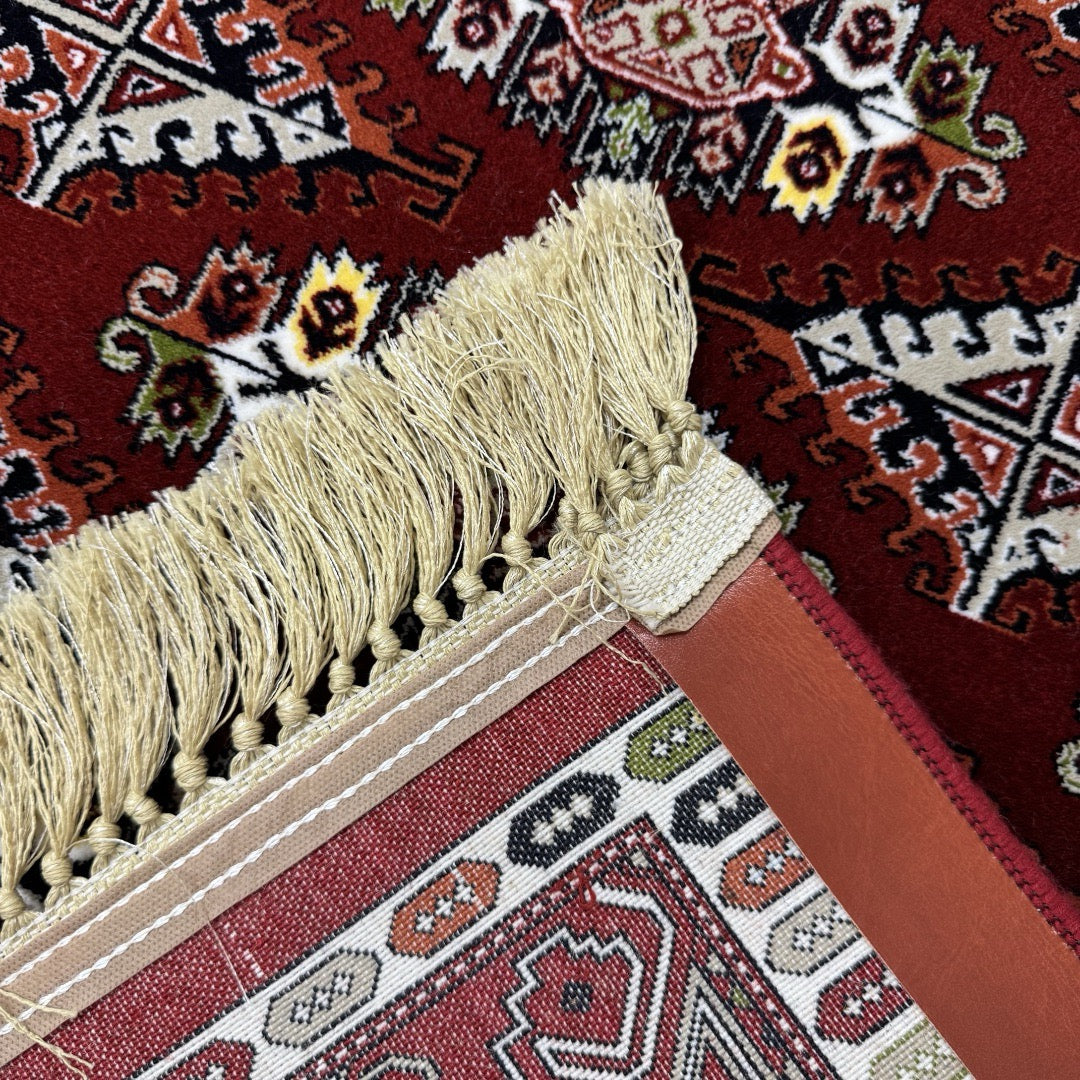 Burgundy Bokhara rug detail