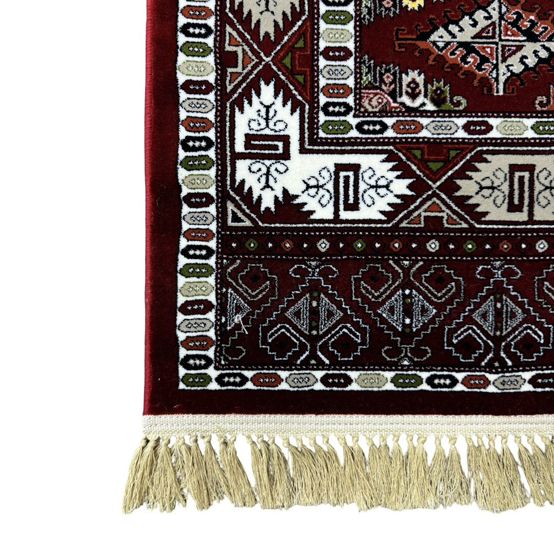 Burgundy Bokhara rug detail