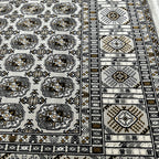 Square cream and grey Bokhara rug detail