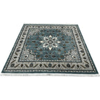 Square blue and cream floral medallion rug detail