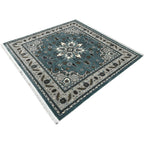Square blue and cream floral medallion rug detail