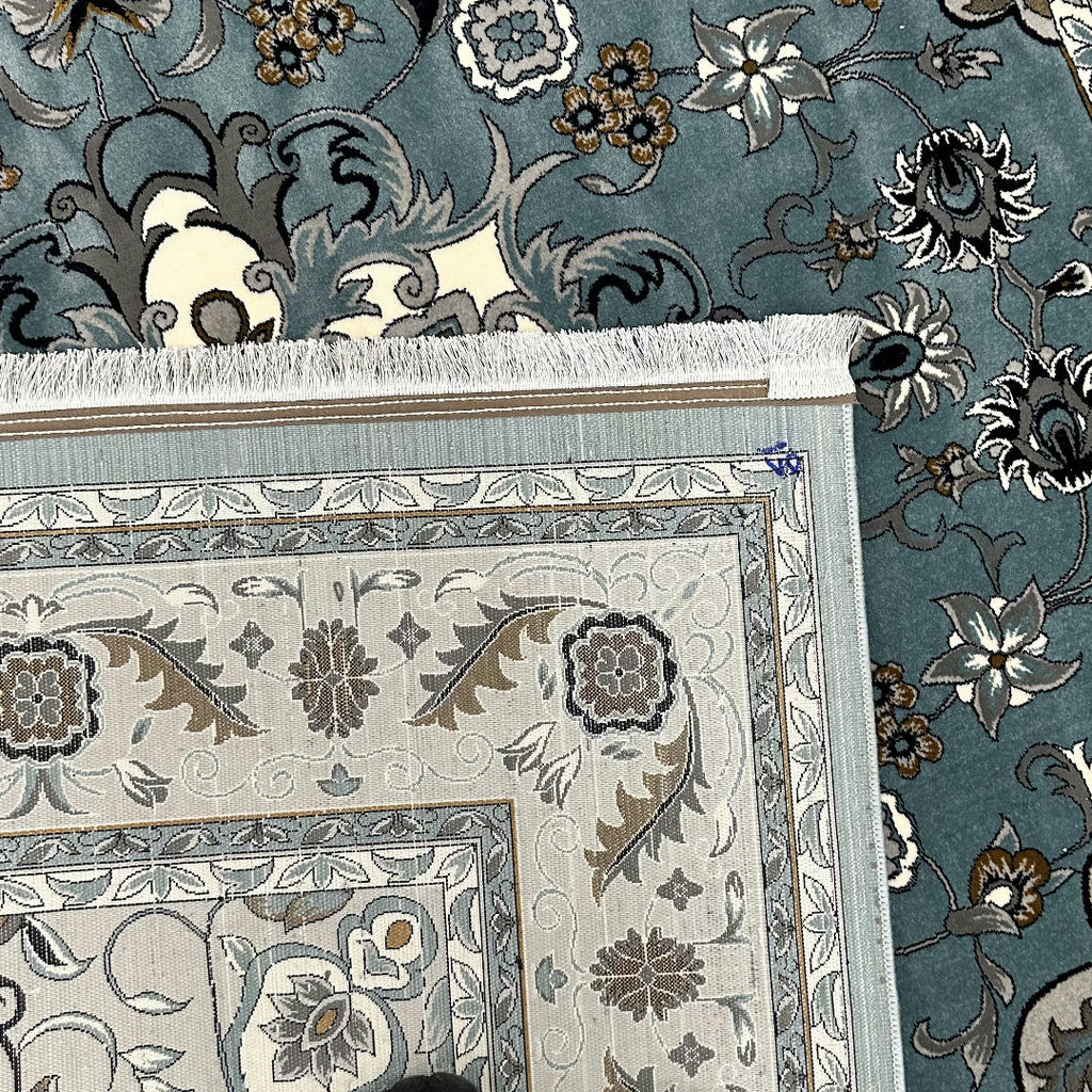 Square blue and cream floral medallion rug detail