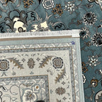 Square blue and cream floral medallion rug detail