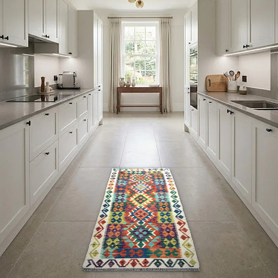 Room view: the rug on the floor of a furnished room, shown at its real size