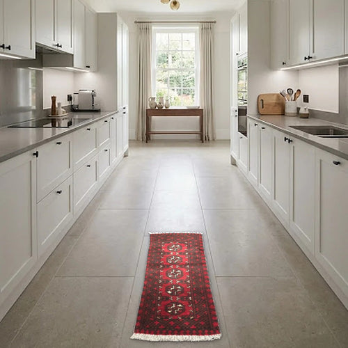 Room view: the rug on the floor of a furnished room, shown at its real size