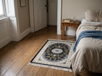 150 x 100 cm Ornate Floral Symphony in Grey & Gold Persian Rug in a bedroom setting